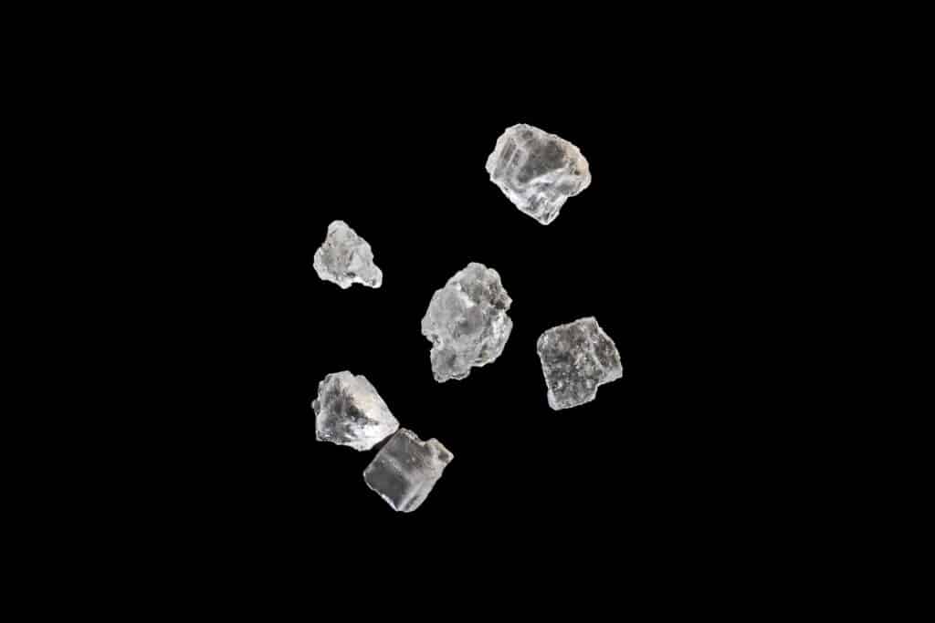 Salt crystals on black background